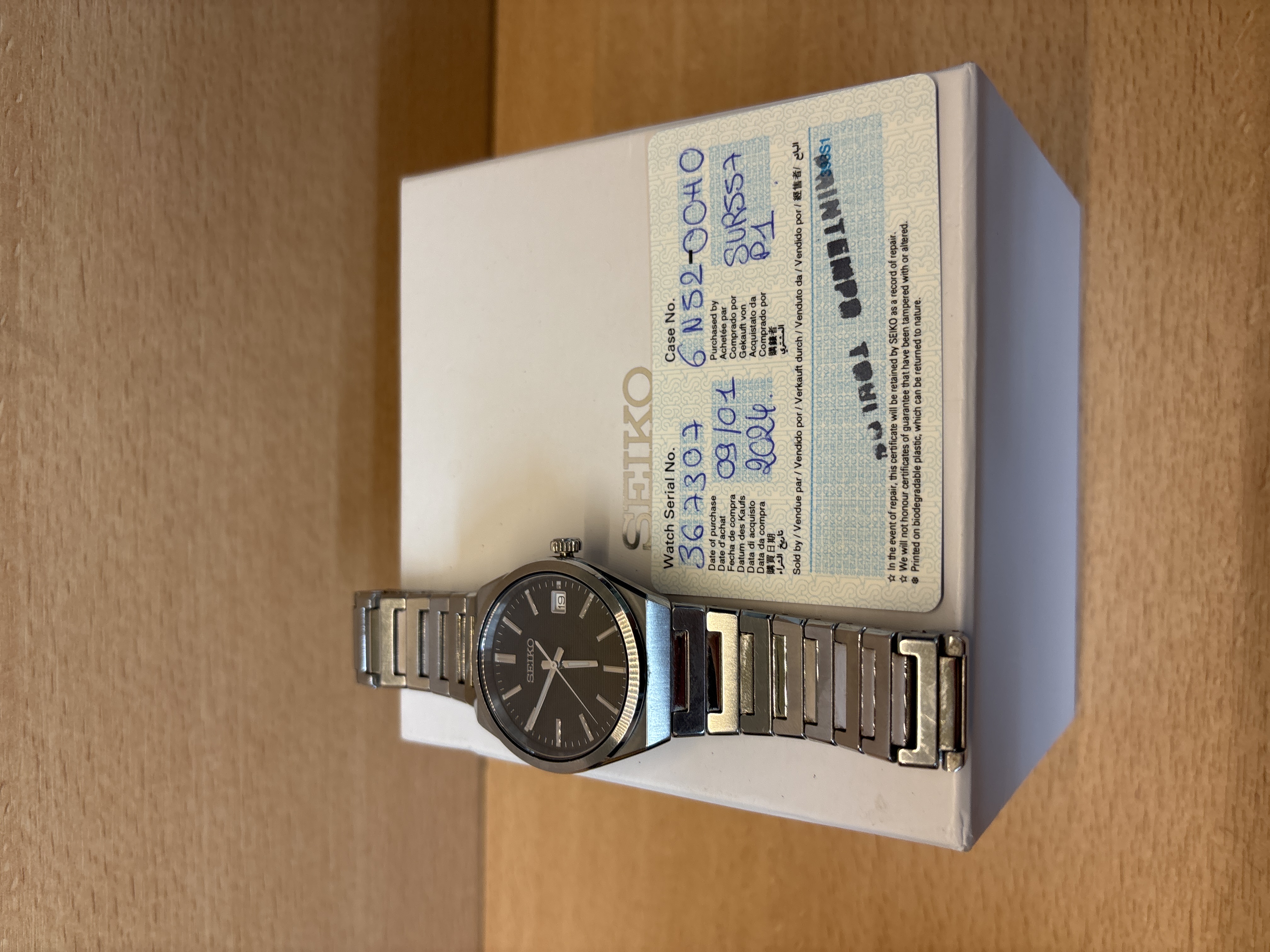 Montre Seiko quartz acier cadran noir dateur