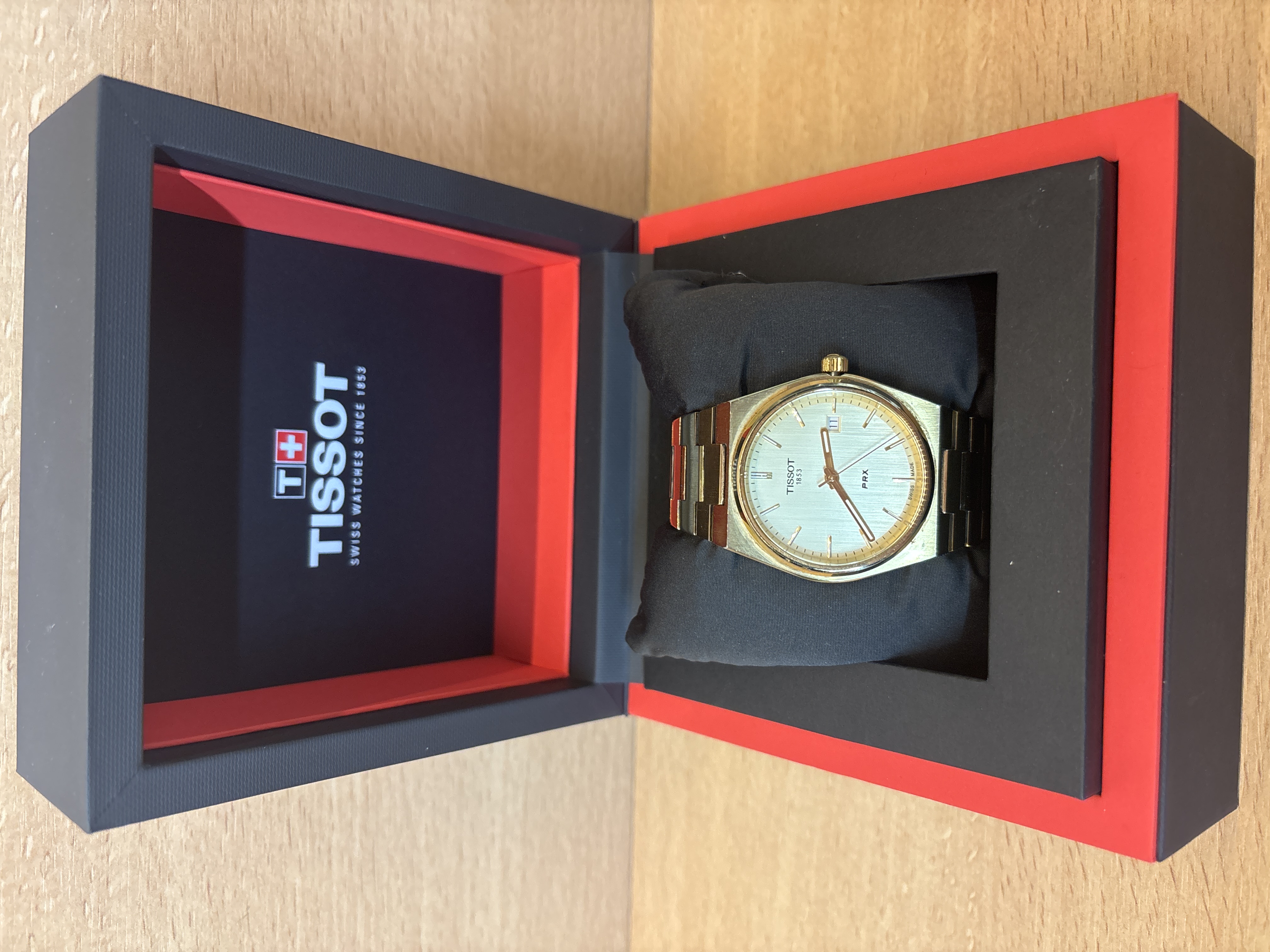 Montre Tissot PRX 1853 dorée avec date et écrin