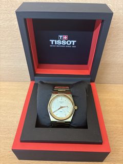 Montre Tissot PRX 1853 dorée avec date et écrin