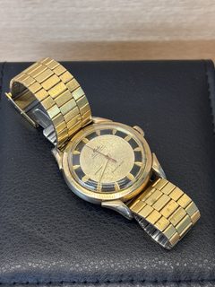 Montre Mido Miltifort bracelet extensible doré